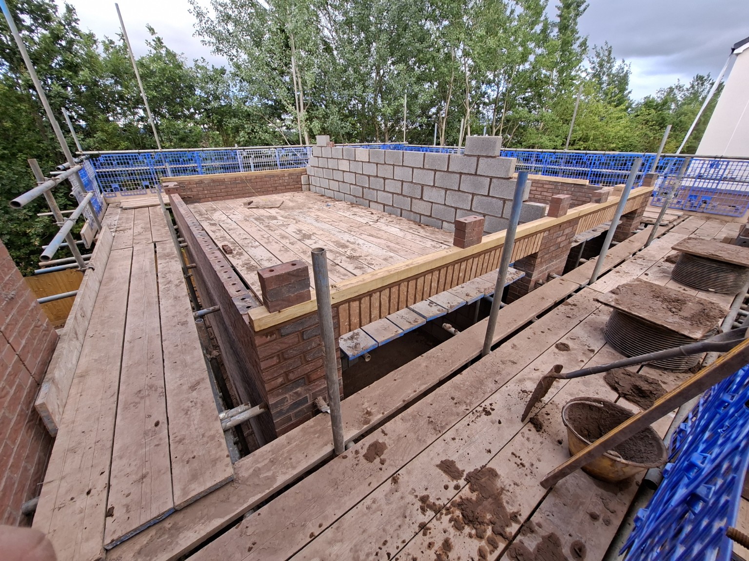 Garage superstructure masonry from scaffold