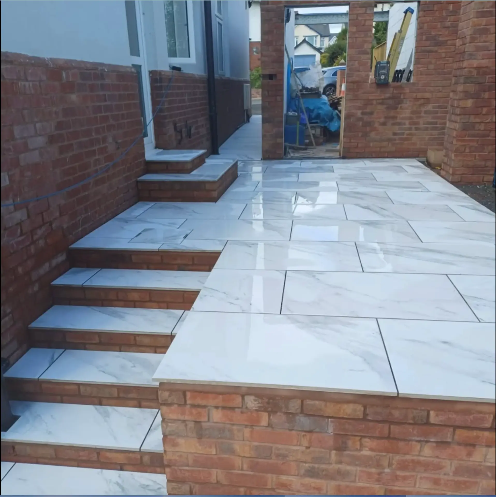 Completed porcelain patio with brick steps, Exmouth