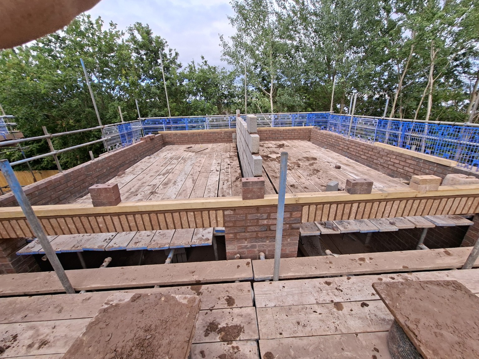 Upper-level brickwork in progress