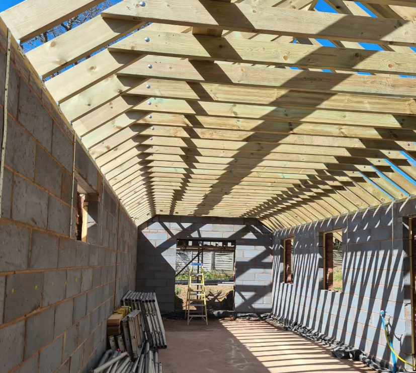 Blockwork garage walls with a newly installed timber roof structure